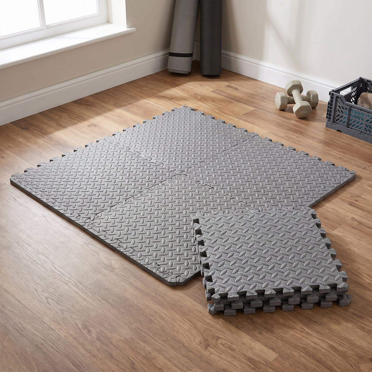 Grey 12mm EVA foam interlocking gym tiles, 610 x 610mm, laid in a home workout corner