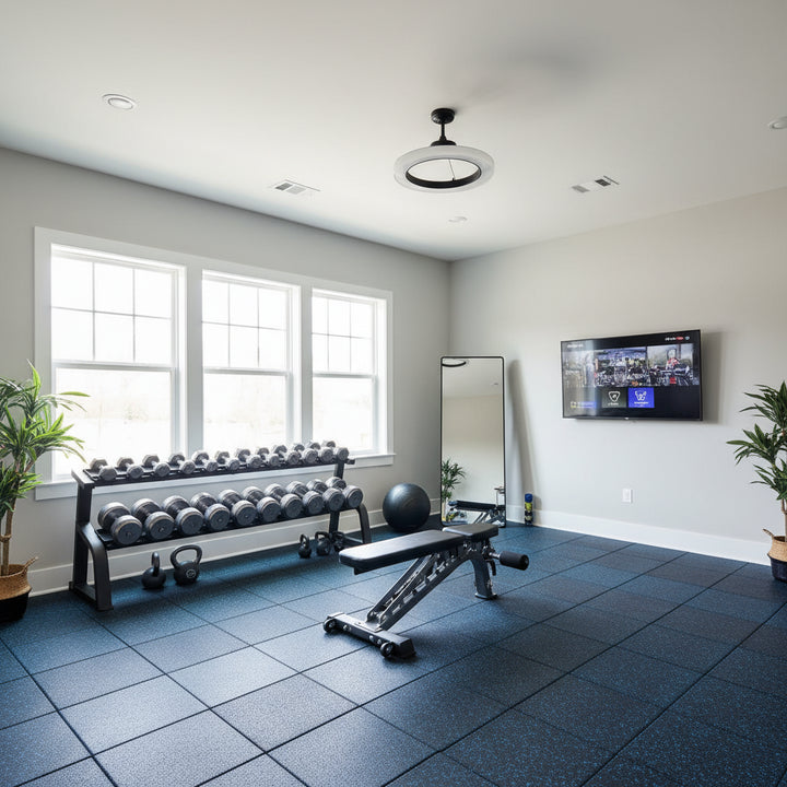 Blue fleck rubber gym flooring installed in modern home gym with dumbbells and weight rack
