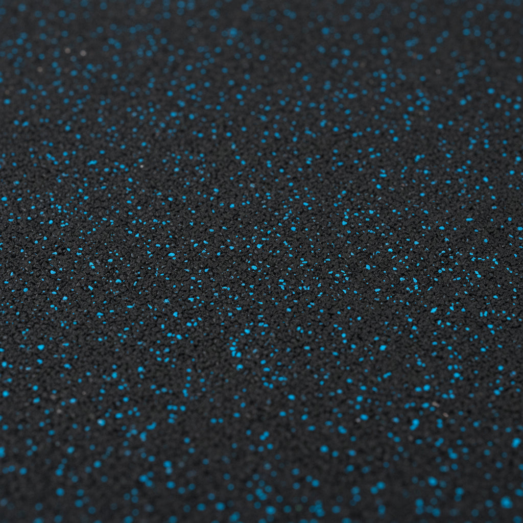 Close-up texture of blue fleck rubber gym tile surface showing EPDM speckled pattern