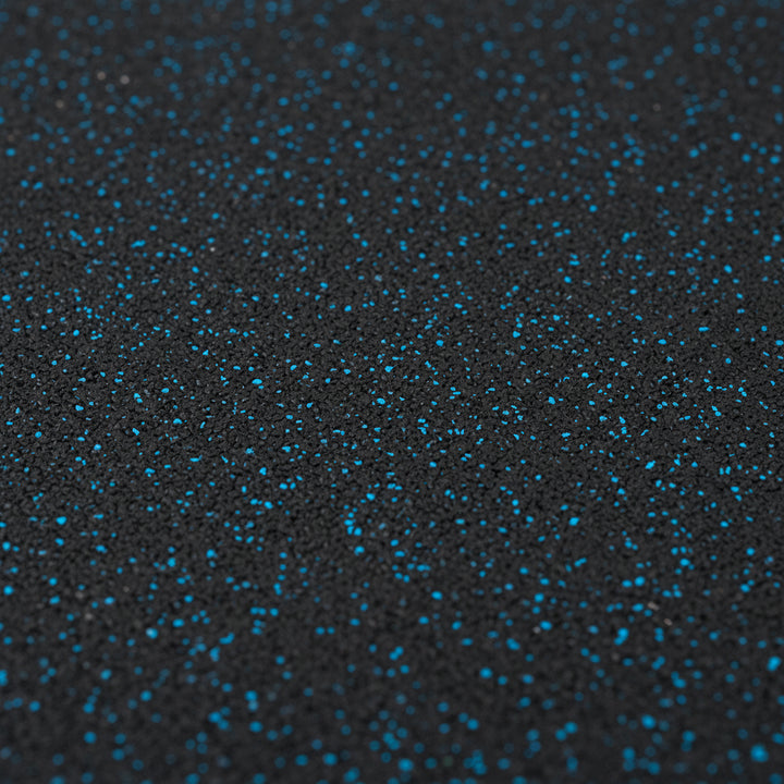 Close-up texture of blue fleck rubber gym tile surface showing EPDM speckled pattern