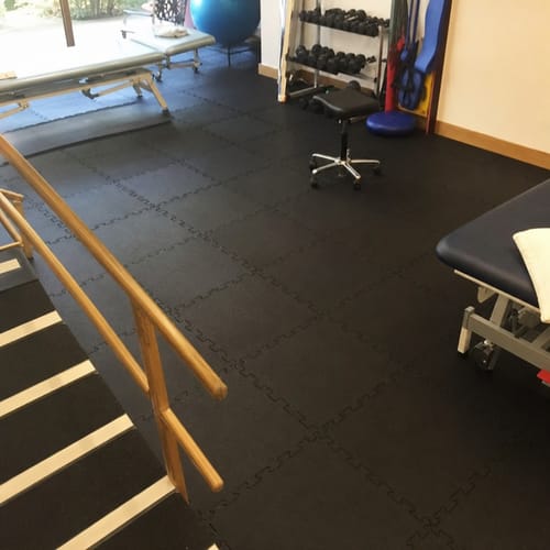 Customer photo: interlocking rubber gym tiles in a rehabilitation centre workout area