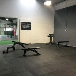 16mm rubber gym tiles in home gym — 65% noise reduction puzzle edge interlocking flooring UK