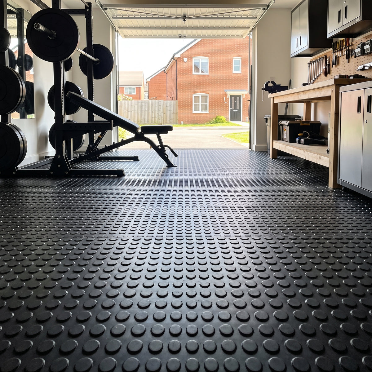 Garage gym and workshop floored with black studded penny rubber flooring