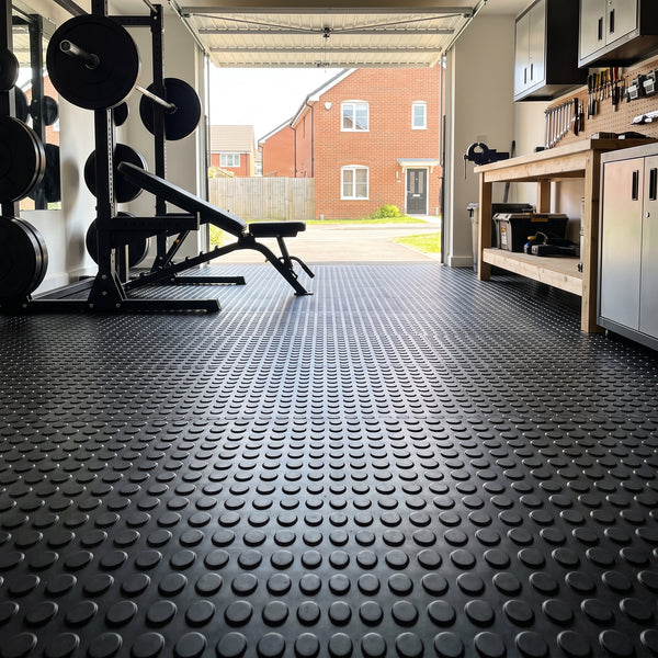 Garage gym and workshop floored with black studded penny rubber flooring